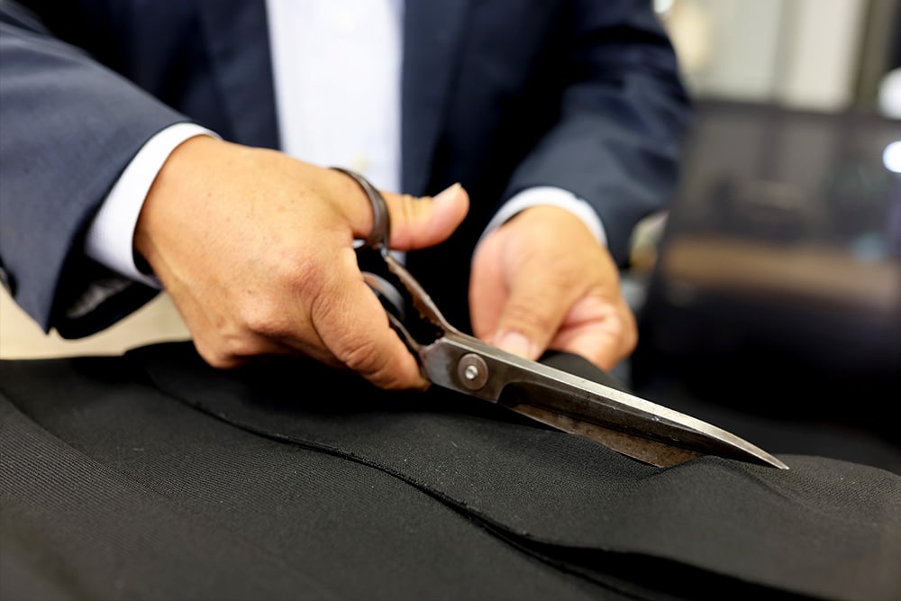 Nick Lopez Tailoring - Cutting Fabric